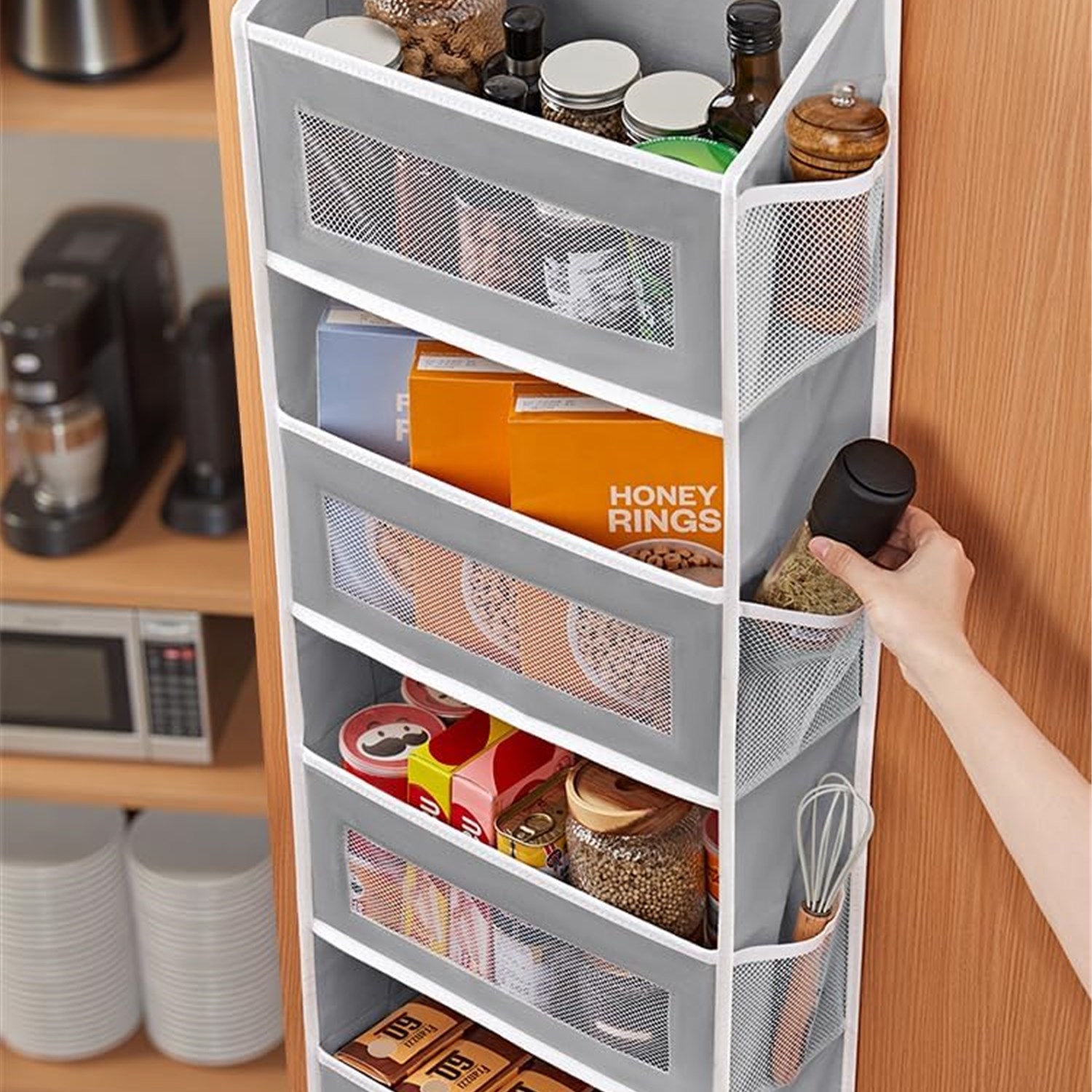 Hanging door organizer in a pantry for jars and supplies